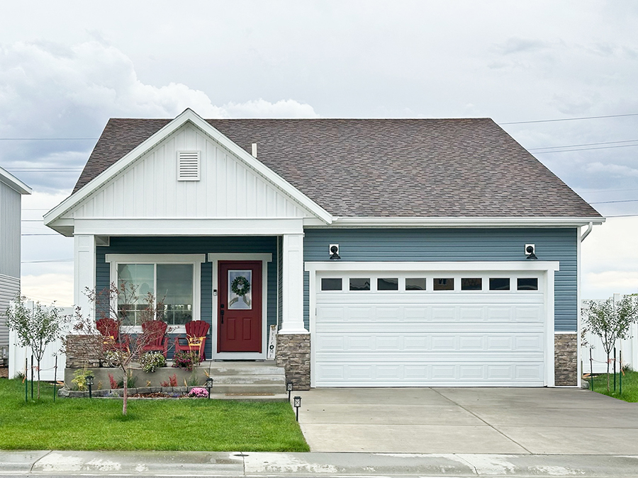 Quaint, farmhouse-style single story home with a spacious front porch, two car garage, and large front window. Quaint, farmhouse-style single story home with a spacious front porch, two car garage, and large front window.
